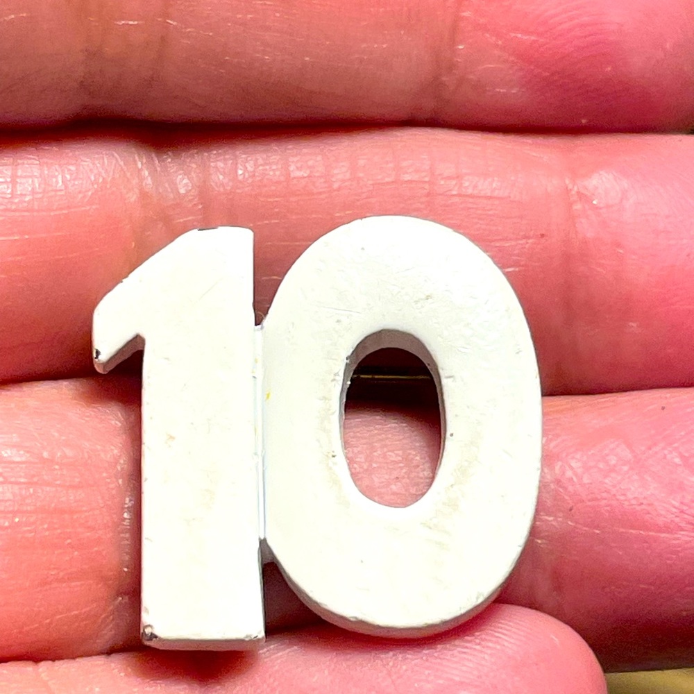 Vintage number 10 metal painted white pin brooch.